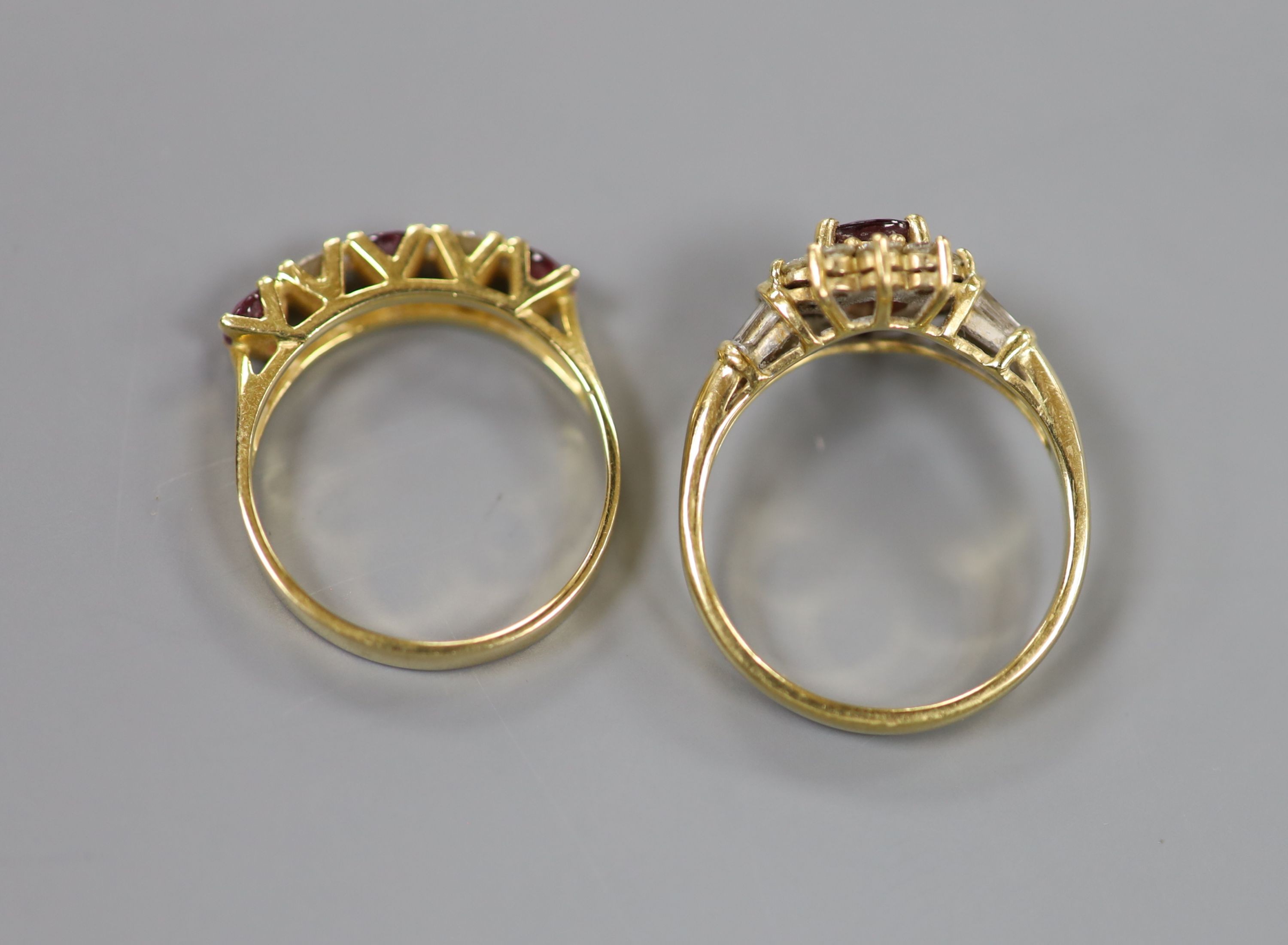 Two modern 18k, ruby and diamond dress rings, including pear shaped cluster and half hoop, sizes Q & P, gross 9.3 grams.